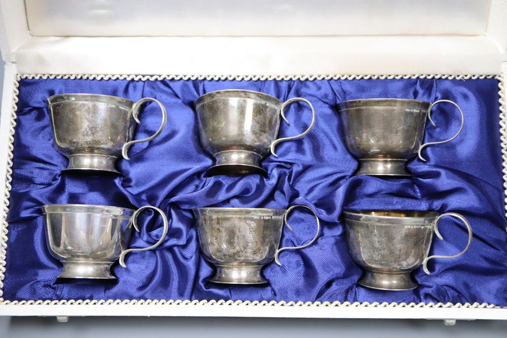 Mixed silver including cased silver cased berry spoons, cups, cream helmet, etc.